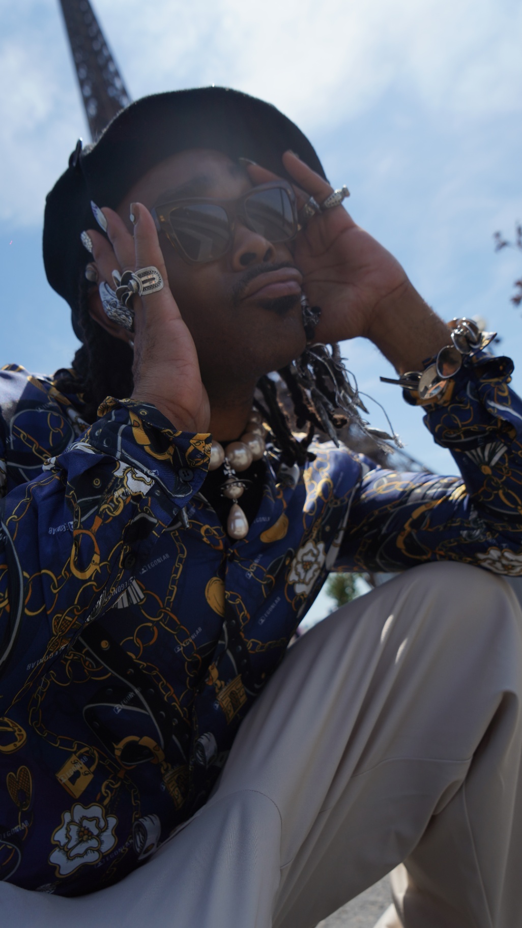 FYRE. adjusting sunglasses, close portrait